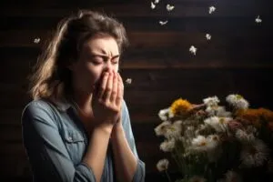 woman-suffering-from-allergy-by-being-exposed-flower-pollen-outside_23-215111063